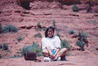 Corim sitting at the edge of Grand Canyon